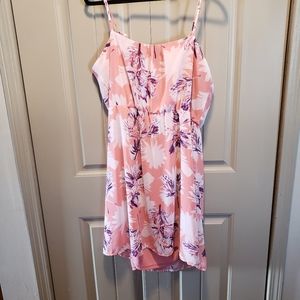 Slip on sleeveless dress in a pretty pink tropical